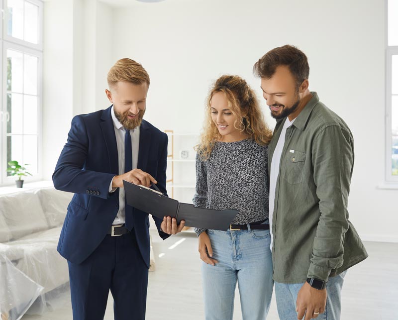 renters going over real estate rental agreement